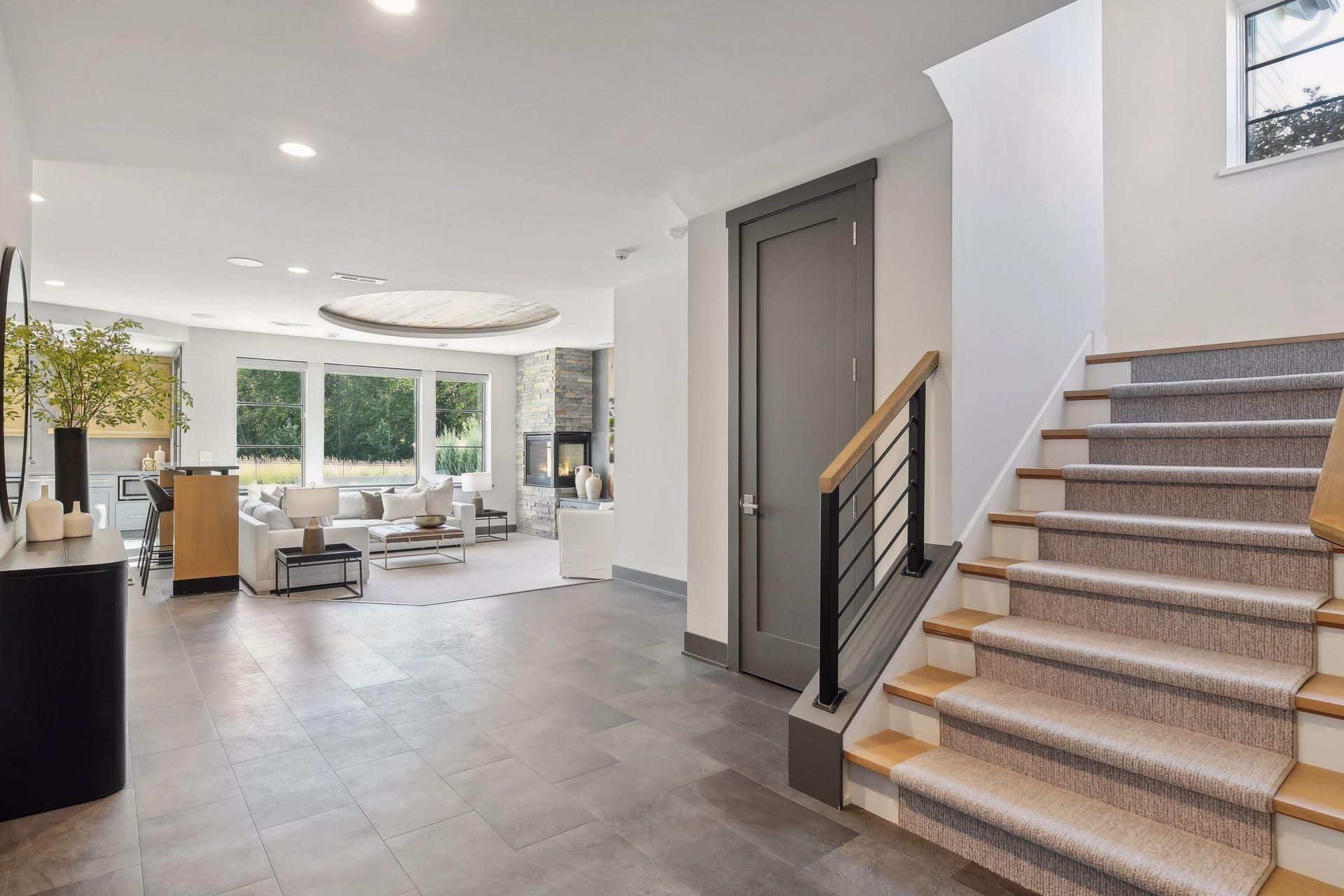 The basement stairs open up to the sun soaked, walkout basement.