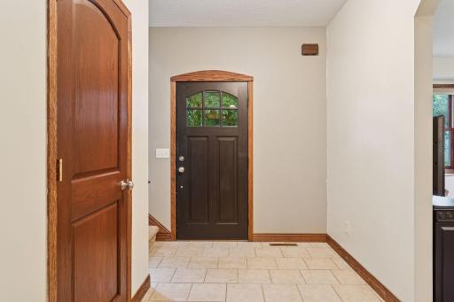 Spacious, tiled front entry with coat closet.