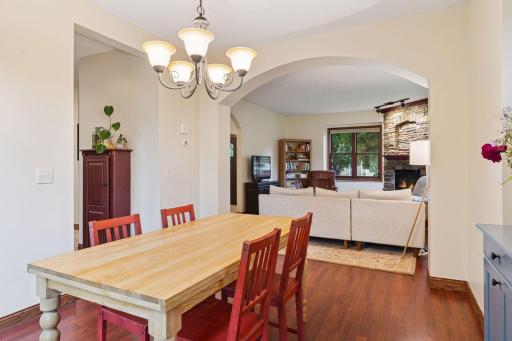 Classic arched door way from dining room to living and living room to front entry.
