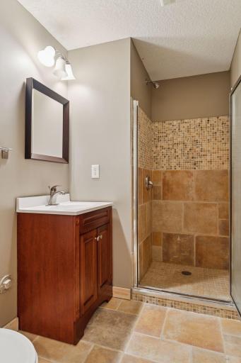 Lower level 3/4 bath with tiled walk-in shower.
