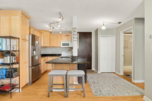Great kitchen with updated cabinetry, countertops, lighting and flooring. Lots of prep space and the sink is in the island!
