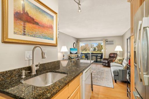 Everything flows beautifully from the kitchen to the living room and out to the expansive covered deck.