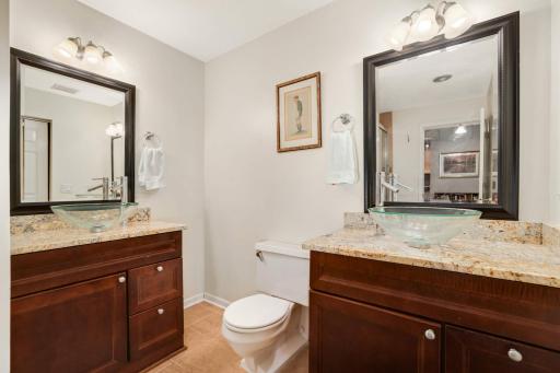 Dual vanities, each with a vessel sink. So many beautiful features here.