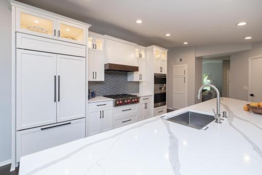 Subzero refrigerator/freezer, center island sink and tons of counter space