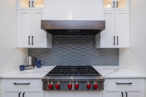 Wolf Stove, tile backsplash, and Quartzlite Counters