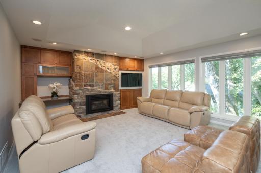 Family room with gas fireplace with stone and slate front
