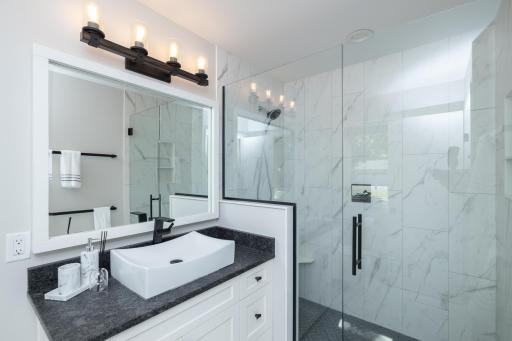 Completely renovated private 3/4 bath with granite counters, new fixtures and custom shower