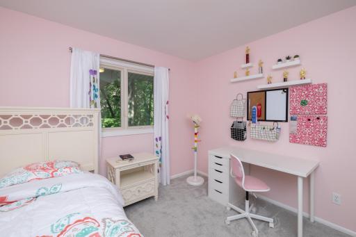 One of two additional main floor bedrooms