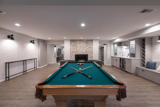 Lower level game room with wet bar, beverage cooler and gas fireplace