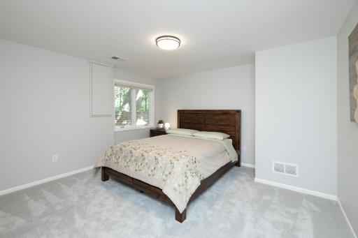 Lower level bedroom with updated carpet and neutral colors