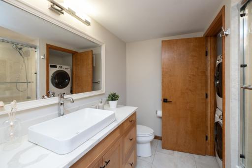 New In-Law suite full bath with its own stackable high end front load LG washer and dryer
