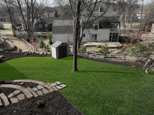 View from deck area overlooking backyard. Photo has been digitally enhanced to show area that sellers are having sod laid