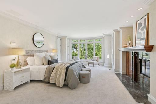 Cozy seating nook by the windows in the exquisite primary suite.