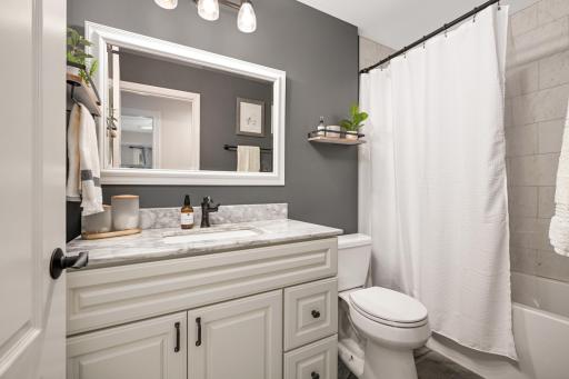 Updated full bathroom on upper level. Linen closet behind door. There is a rough-in for a 3/4 bath in the lower level.