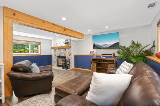 Newer flooring in this lower level family room. Huge lookout windows on the front and back of the house.