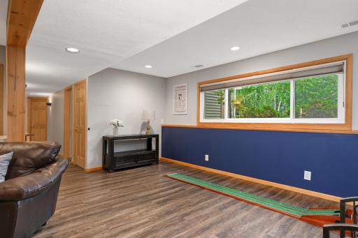 Amusement room offers a gas fireplace with stone surround. Rough-in for 3/4 bath in lower level.