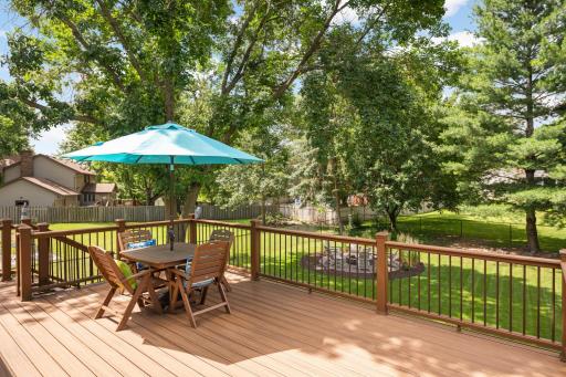 Huge maintenace free deck over-looking the incredible fenced-in backyard.