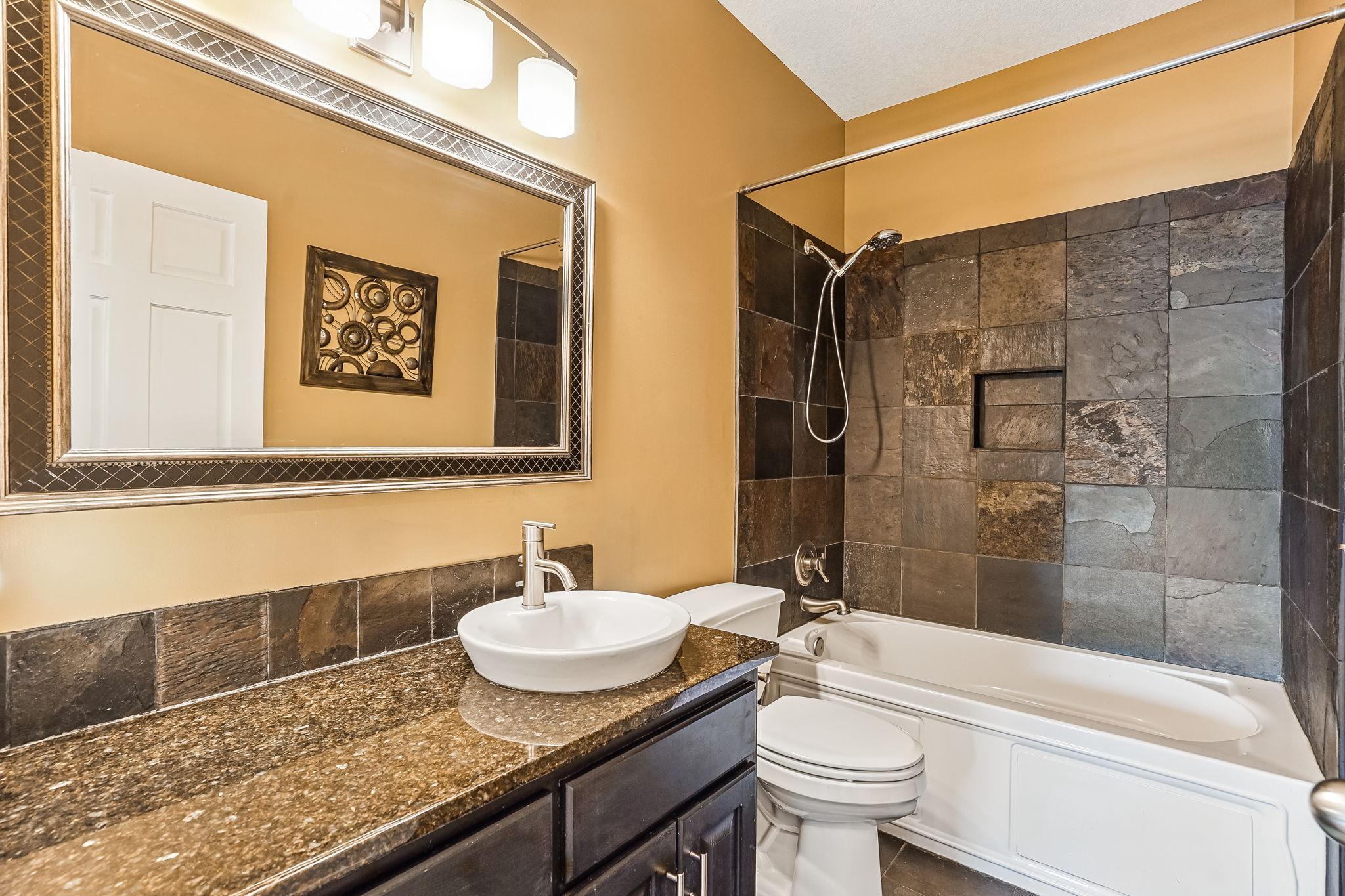 Main level full bathroom with tile shower!
