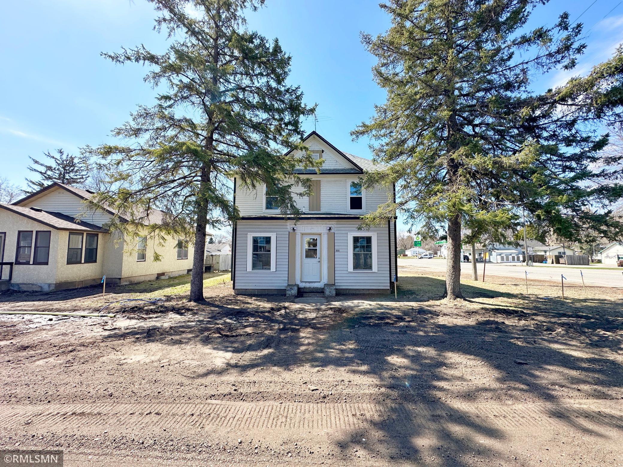 This stately two-story residence sits proudly on a spacious corner lot, nestled in the heart of South Haven.