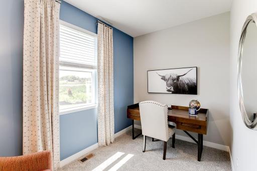 Main floor flex room creates a versatile space for you to use how you want. Photo of model home similar to new Henry plan, color & options will vary.
