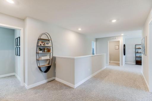 Open upstairs with Primary Suite, 3 other bedrooms, laundry, and a loft! Photo of model home similar to new Henry plan, color & options will vary.