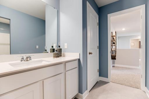 Photo of model home similar to new Henry plan, color & options will vary.