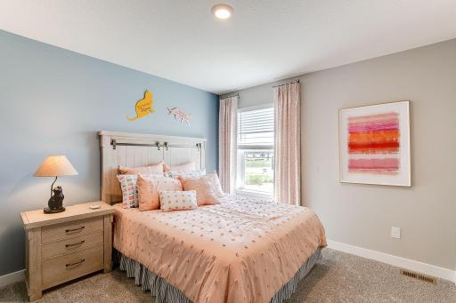 Photo of model home similar to new Henry plan, color & options will vary.