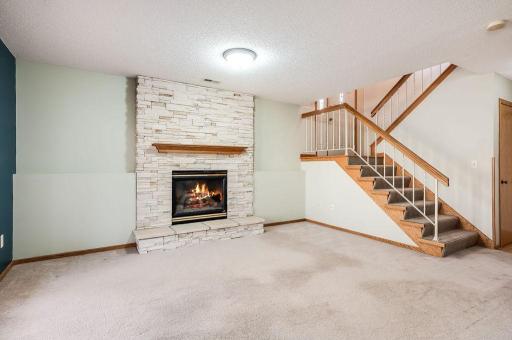 Lower level family room with gas fireplace.