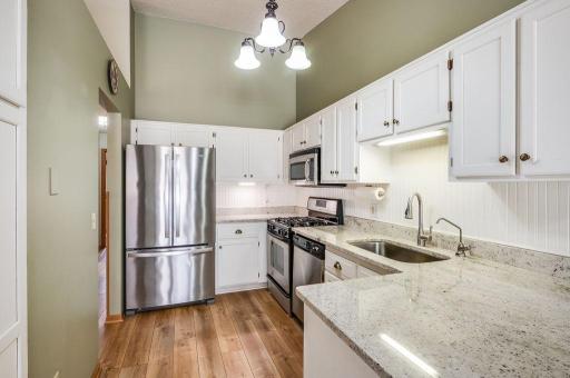 Updated kitchen with granite countertops and appliances.