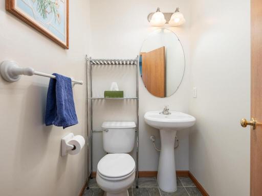 Main floor powder room off the entryway for guests & convenience.
