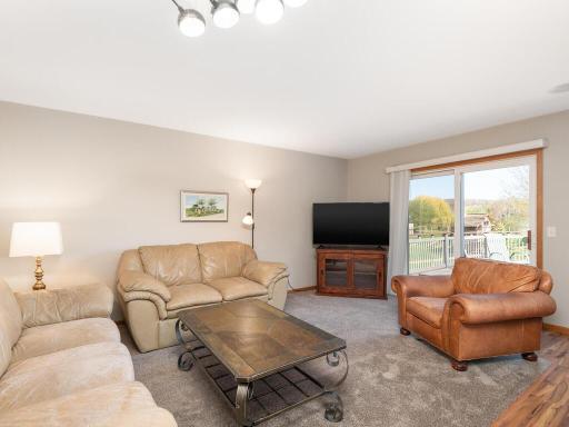 Main floor family room is open to kitchen, walks out to maintenance free deck & has long views of the backyard.