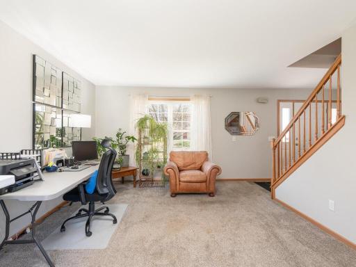 Generous main floor living spaces, this front facing living room can also be used as an office or a formal dining space.