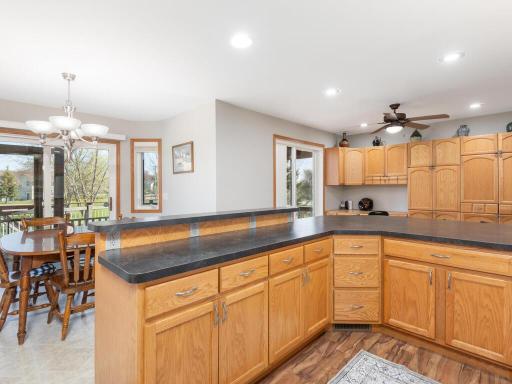 Kitchen & dining room open to awesome deck & screened in porch.
