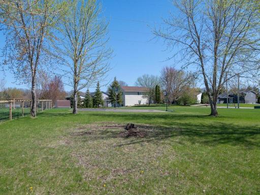 Large asphalt sport court for practicing your basketball shot or add a net & play some pickleball. Trail along back of property provides a short walk to Community Park!