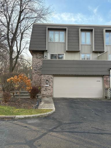 IMG_38End-unit townhome with classic brick and siding exterior, attached garage, and winter-ready driveway. This desirable end-unit location provides extra privacy and allows for excellent natural light throughout the home.80.jpg