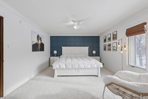 Open and airy primary suite with balanced proportions and clean finishes. The end-unit exposure enhances brightness and offers a relaxing retreat.