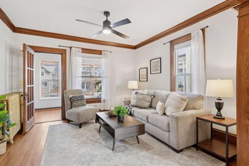 The living room is open to the sunny 3 season porch and formal dining room.