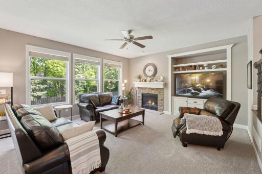 Cozy great room with gas fireplace and backyard views