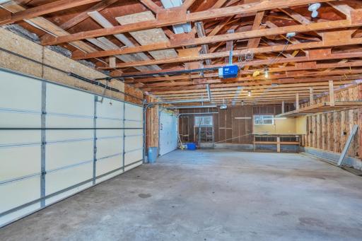 Insulated overhead doors and work space in the triple garage!