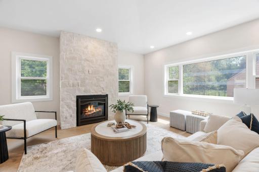 Custom built gas fireplace with the most gorgeous stonework
