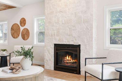 Custom built gas fireplace with the most gorgeous stonework