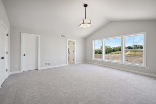 Owner's suite includes vaulted bedroom, large walk-in closet and spacious owner's bathroom. Photos, virtual/video tours may not depict actual home. Features, materials & finishes shown may contain options that are not included in price.