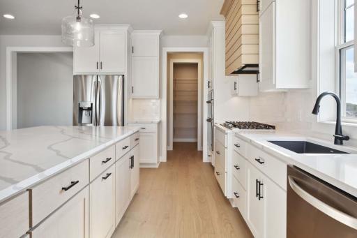 Savannah Kitchen w/10' island! Photos, virtual/video tours may not depict actual home. Features, materials & finishes shown may contain options that are not included in the price.