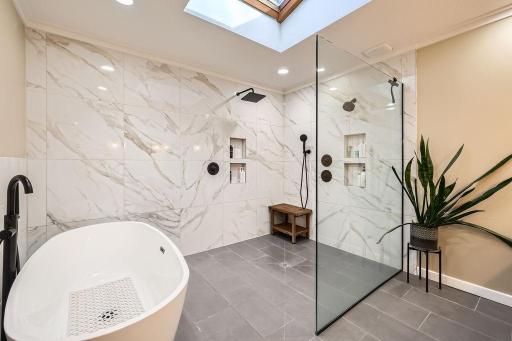 This bathroom remodel was just completed and WOW is just not sufficient enough to describe this gorgeous bath. A wet room with soaking tub and gorgeous tile work. A skylight above floods this area with natural light. This is a million $$ bathroom