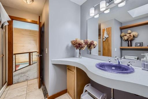 This 3/4 bathroom on the second floor has a blt in cement sink, linen closet and shower. There are 3 places to shower in this home so every bedroom has a bath
