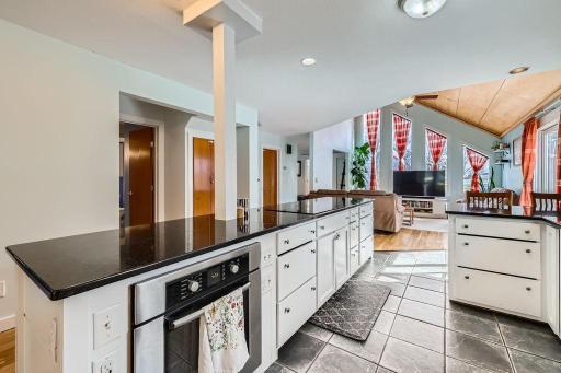Check out this kitchen with it's sleek black granite countertops that contrast beautifully with the crisp white cabinetry