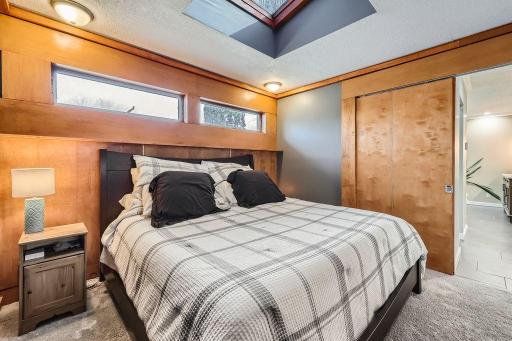 The wood accents in this home are warm and inviting. The upper level has newer carpet and this king size bed fits perfectly. Now wait until you see the BATH!!!!