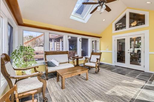 Baseboard heat allows use of this beautiful sunroom 3 seasons of the year. The ambiance is bright, warm, and inviting, creating a perfect space for relaxation, reading, or enjoying the natural surroundings from the comfort of indoors