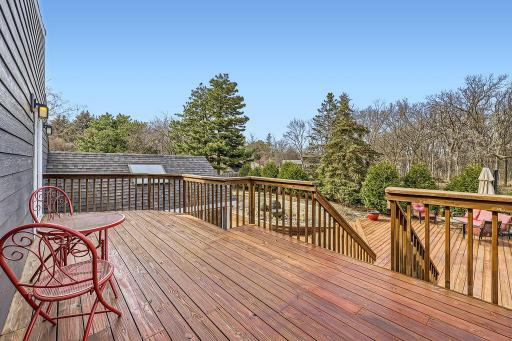 This is the view from the deck off the upper primary bedroom. Can you see yourself sitting out here in the am with a cup of coffee enjoying the beautiful backyard? Your own private retreat area