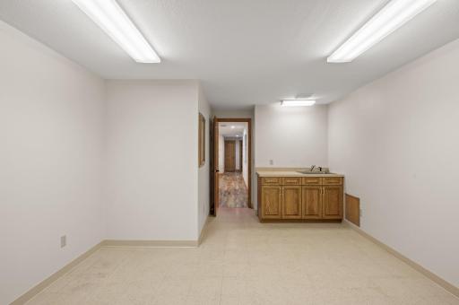 Lower level also features a great size workshop with vanity and sink.